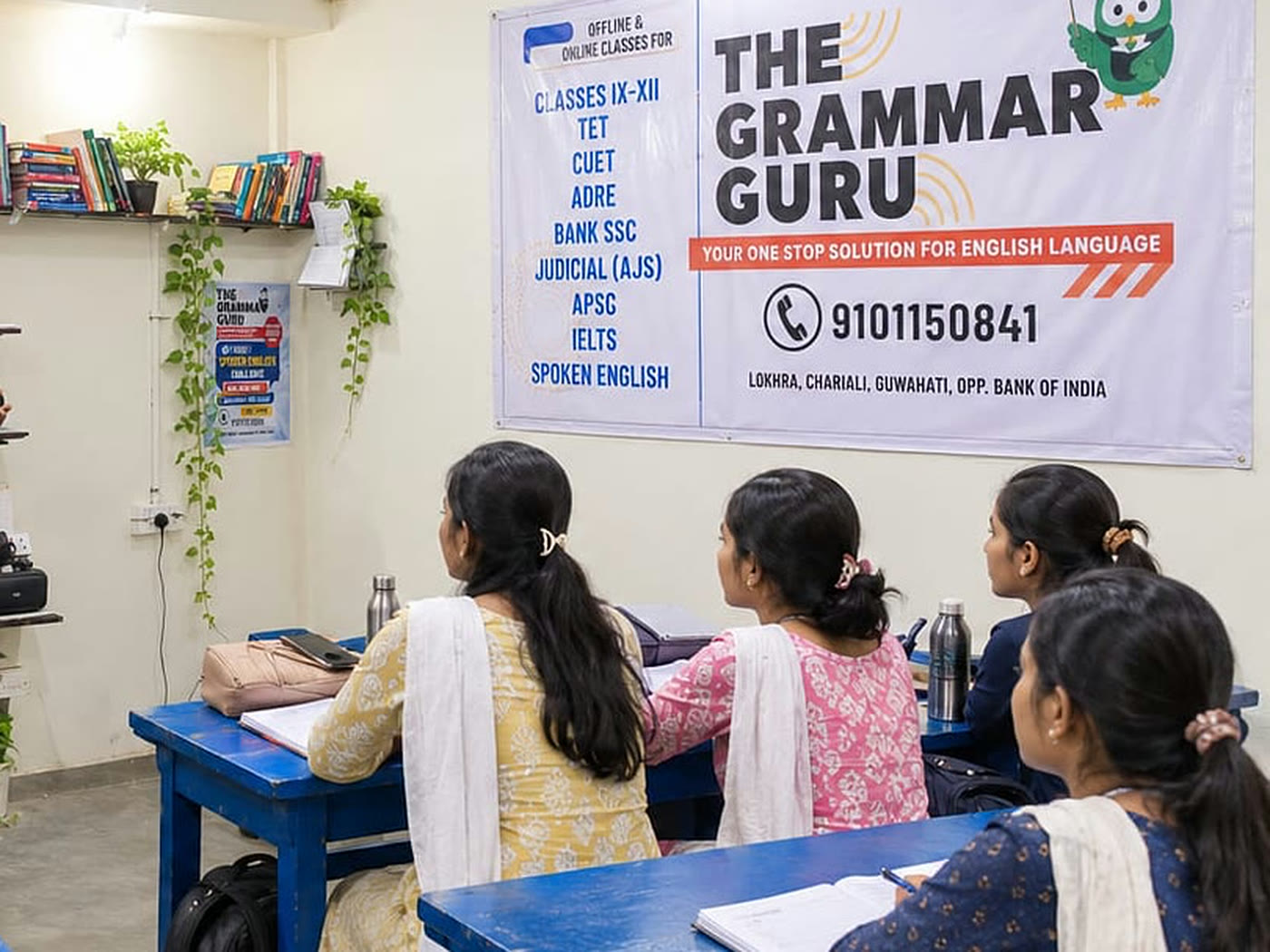 A class in progress at The Grammar Guru, Lokhra Chariali — the batch at their desks under the institute's banner